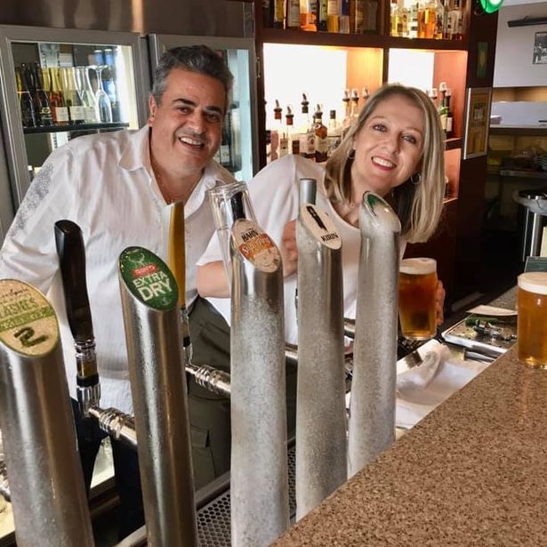 Happy couple enjoying their cold drinks